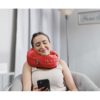 person texting while wearing comfortable neck supporting pillows for sleeping travel spine support - red