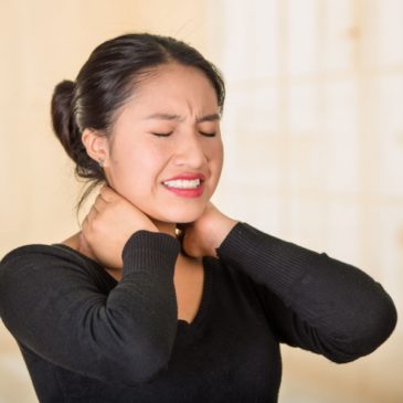Asian woman with neck pain