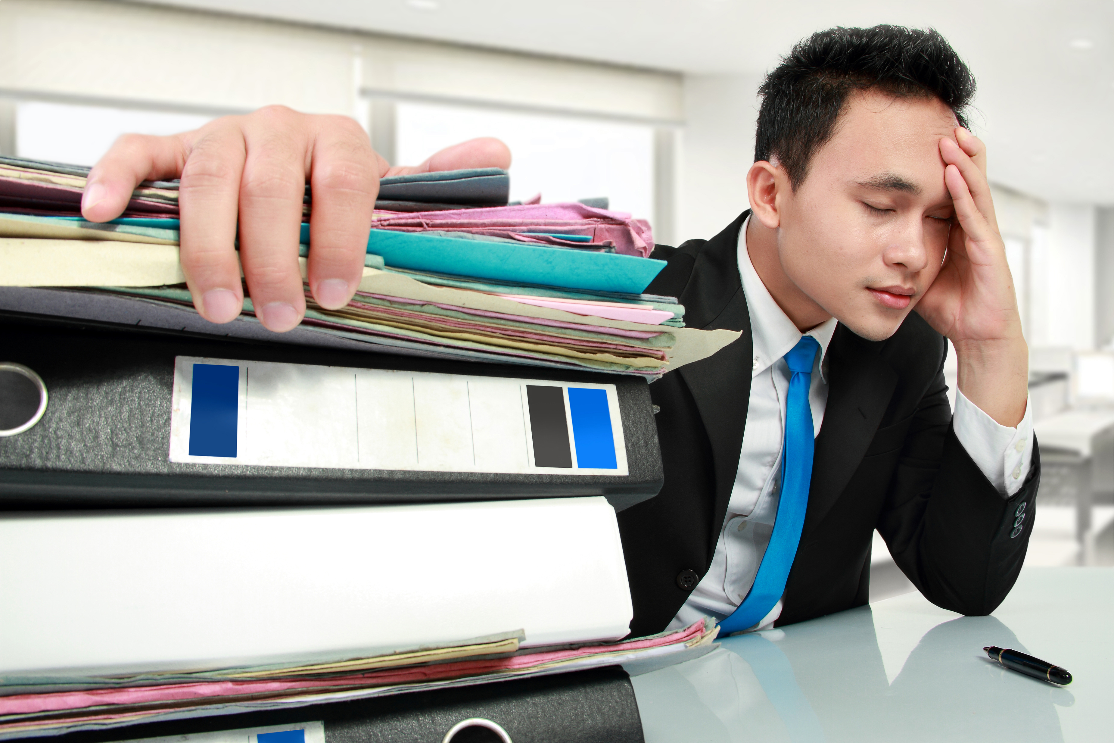 Portrait of busy businessman stressed at work