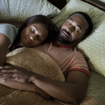 black couple sleeping.