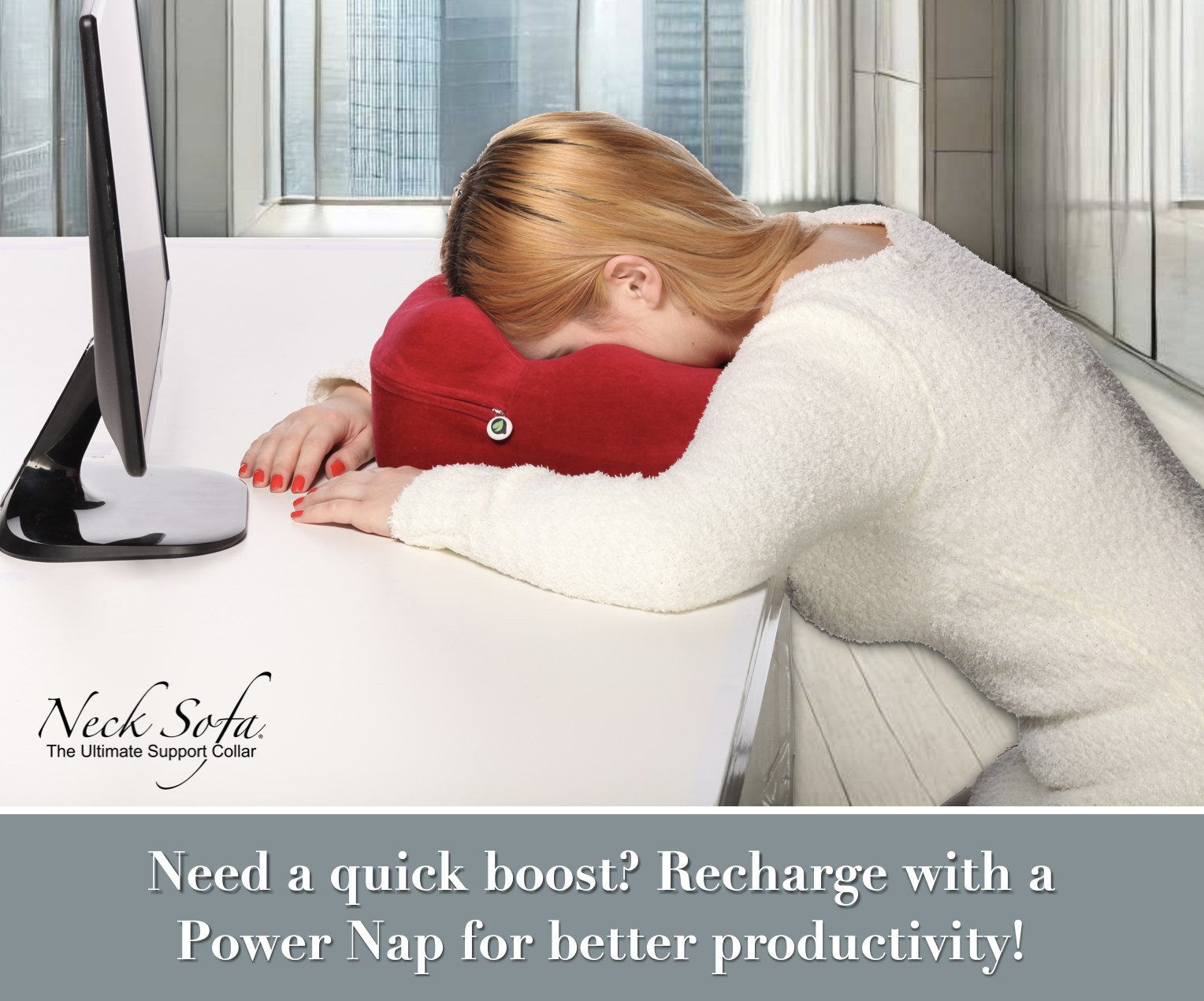 Bright modern office room with large windows, with a city view outside. A woman at her desk taking a power nap with a Burgundy Neck Sofa Pillow. 