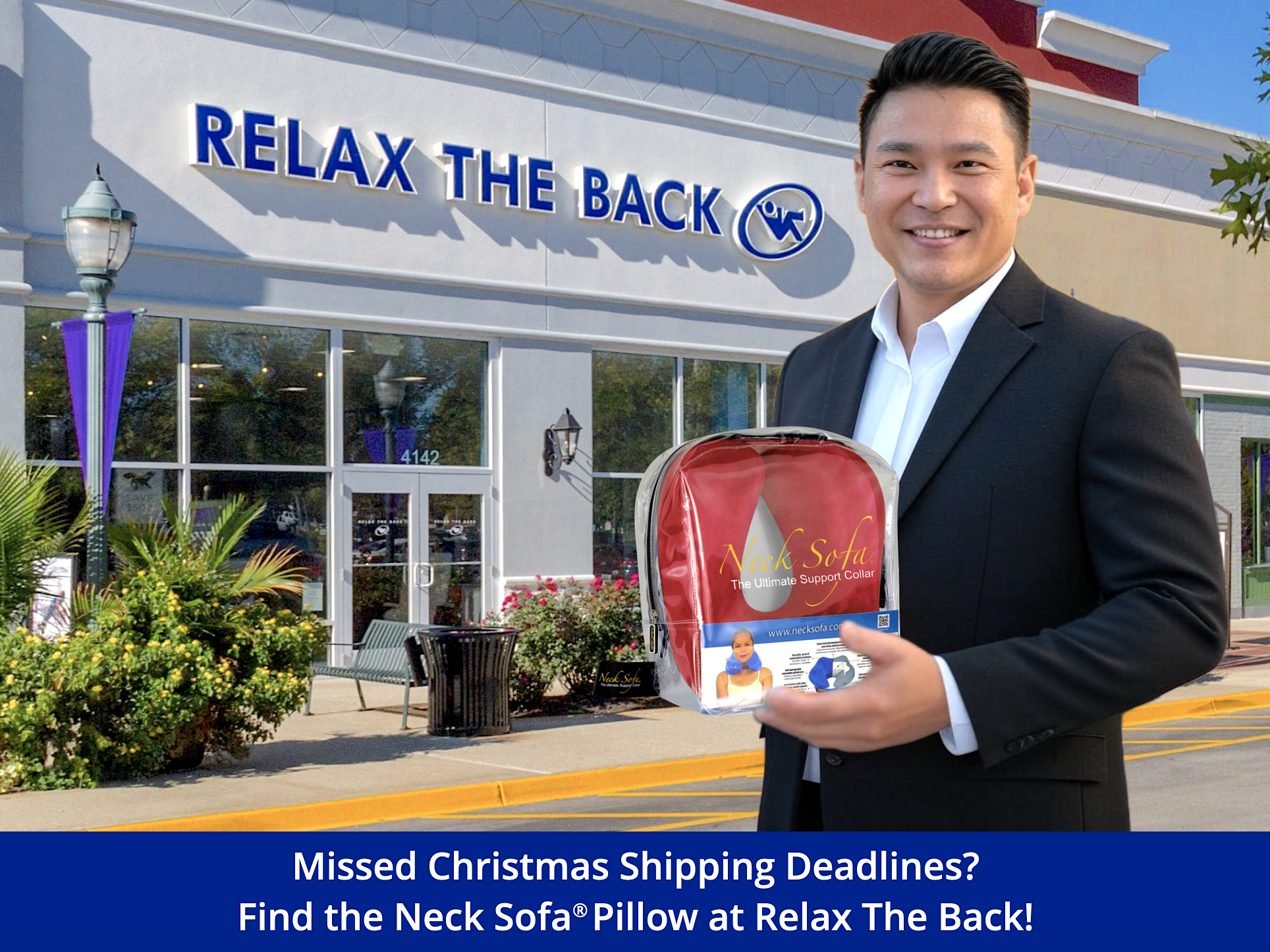 Picture of an Asian man standing in front of a Relax The Back Store holding a Burgundy Neck Sofa® Pillow