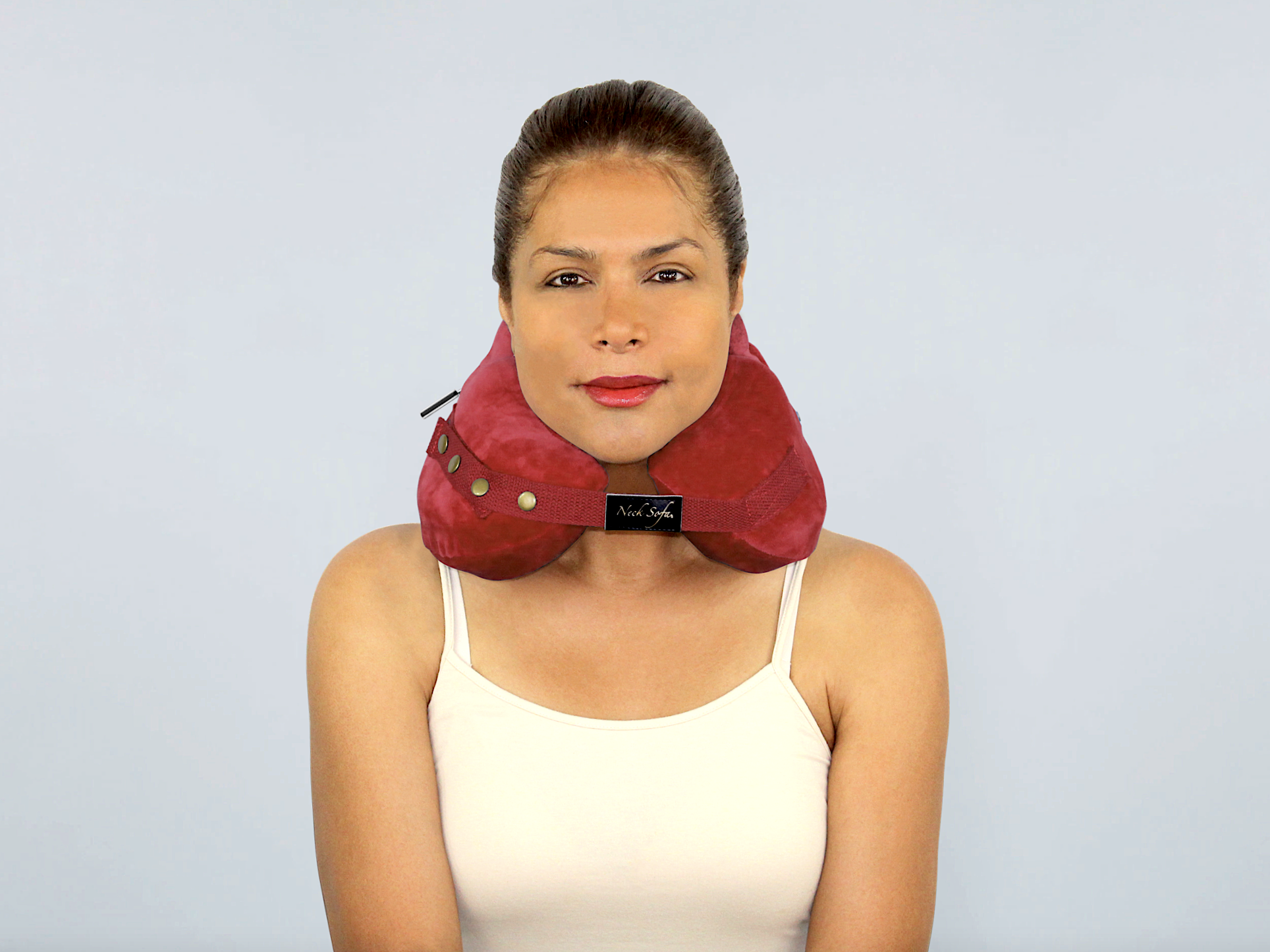 Woman wearing the Neck Sofa® Pillow
