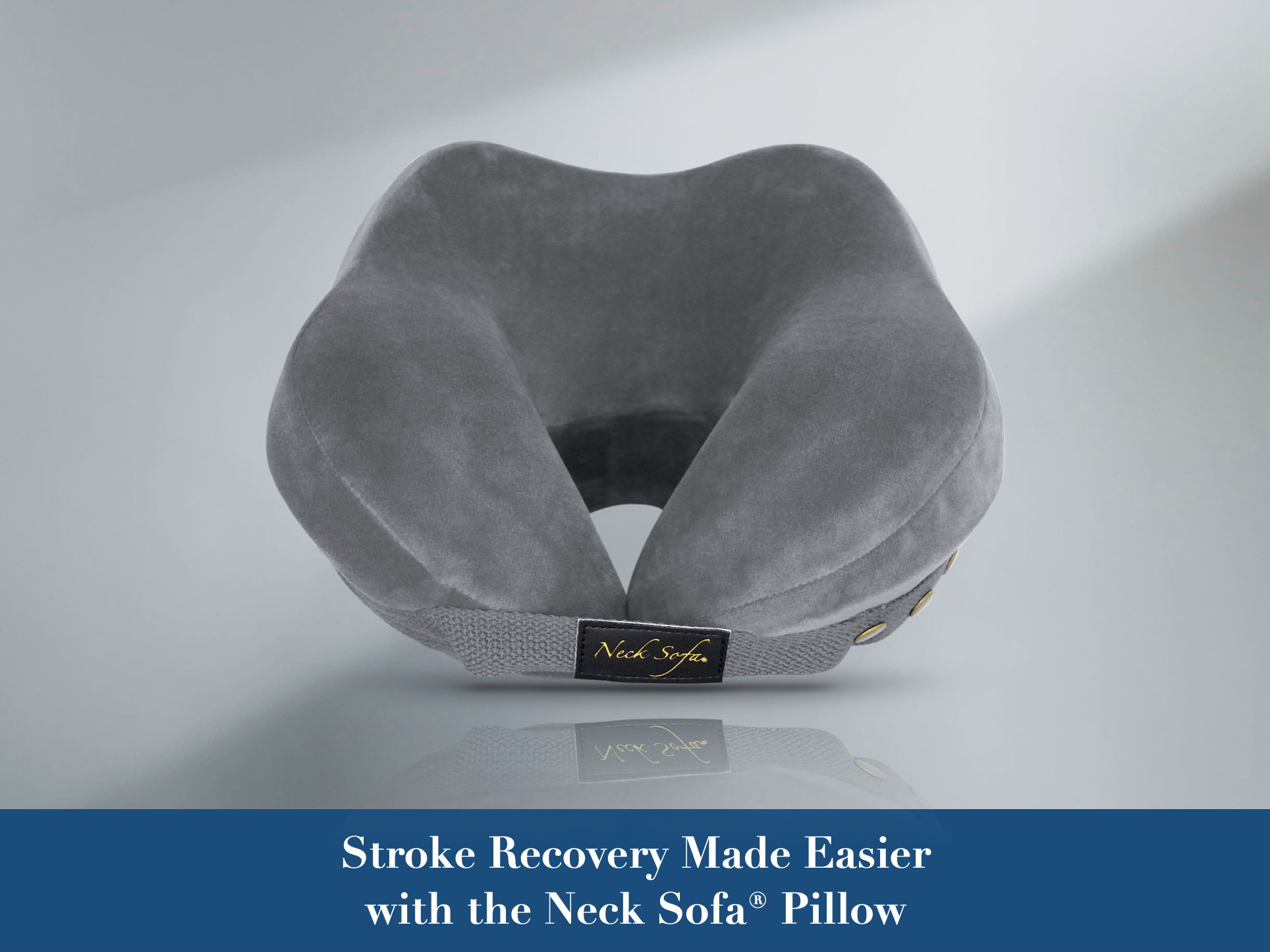 Grey Neck Sofa Pillow on a Grey background with the text Stroke Recovery Made Easier with the Neck Sofa® Pillow.